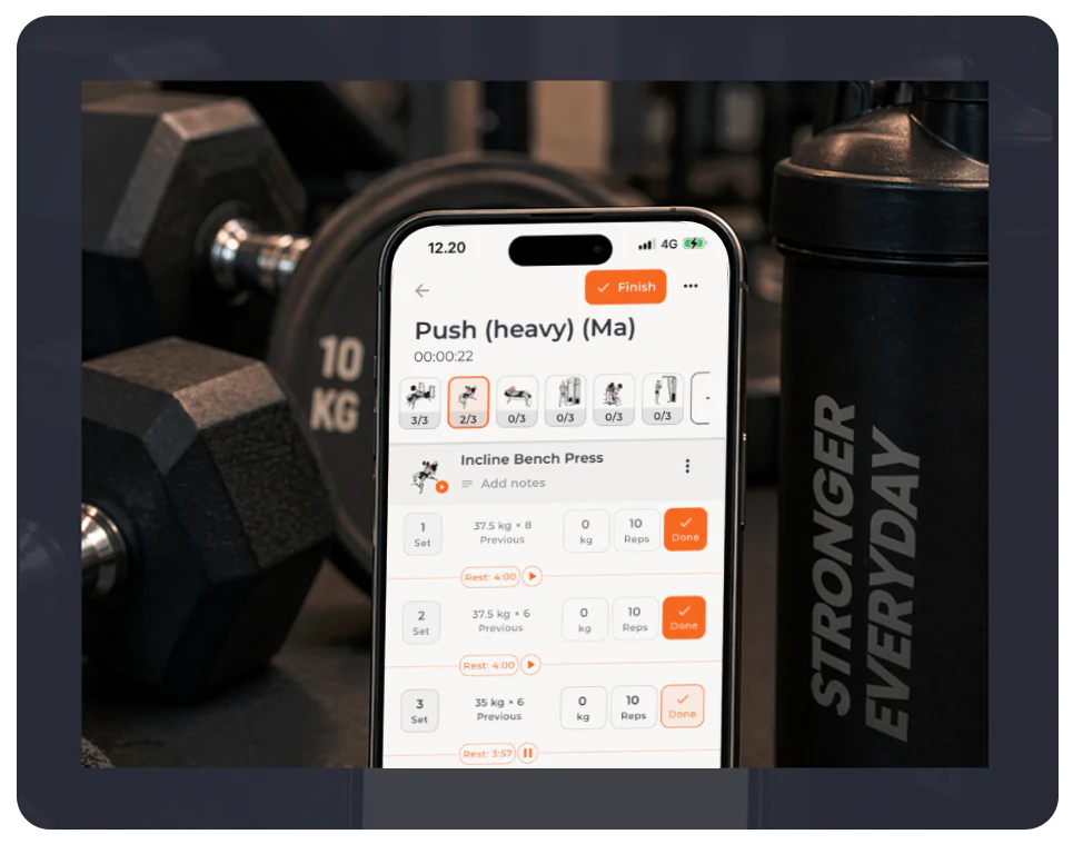 Bodyper live workout screen shown on a phone beside gym equipment